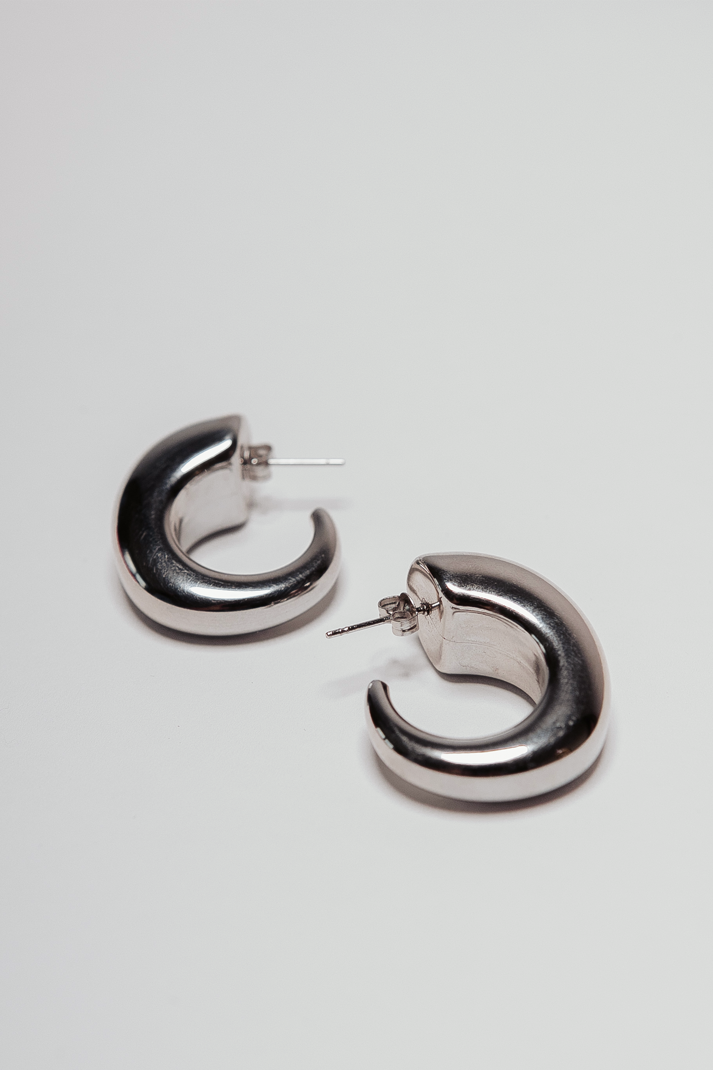 Silver curve tapered hook hoops earrings